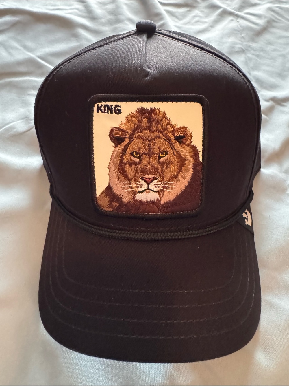 Goorin Bros Black Trucker Hat with Embroidered Lion Patch - "King"